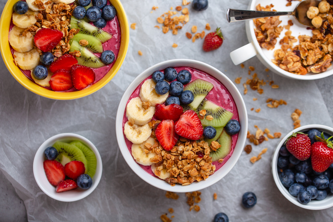 fruit smoothie bowl with granola and berries
